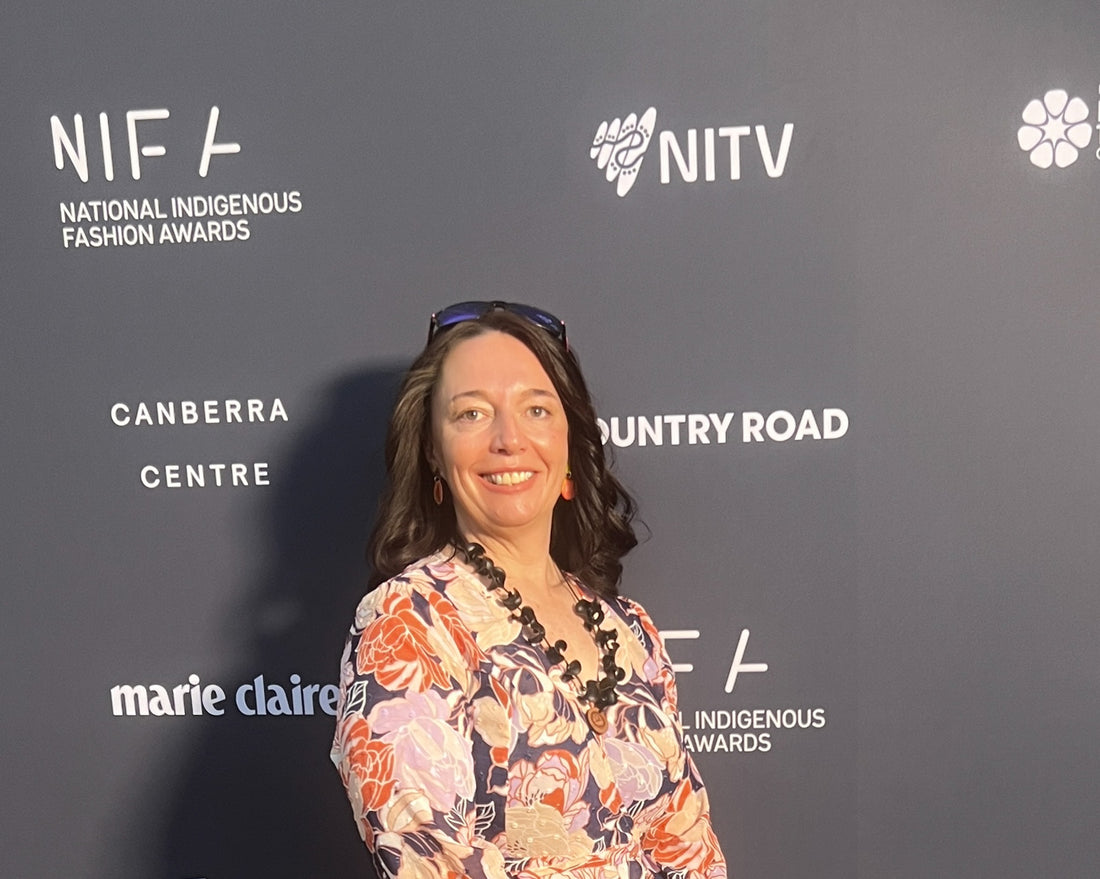 Lady dressed in floral dress with grey background
