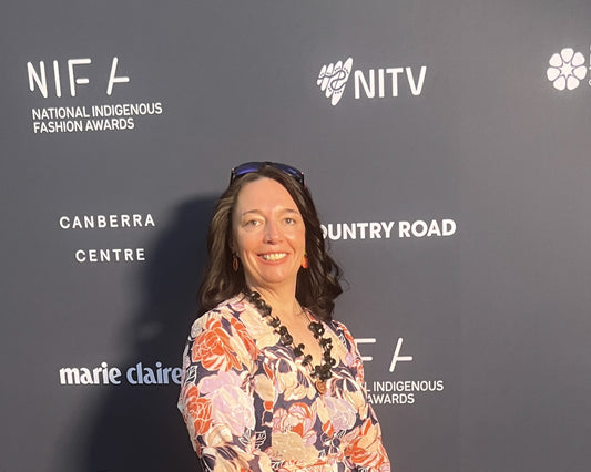 Lady dressed in floral dress with grey background