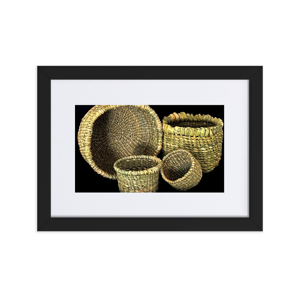 Four hand woven baskets on black background.