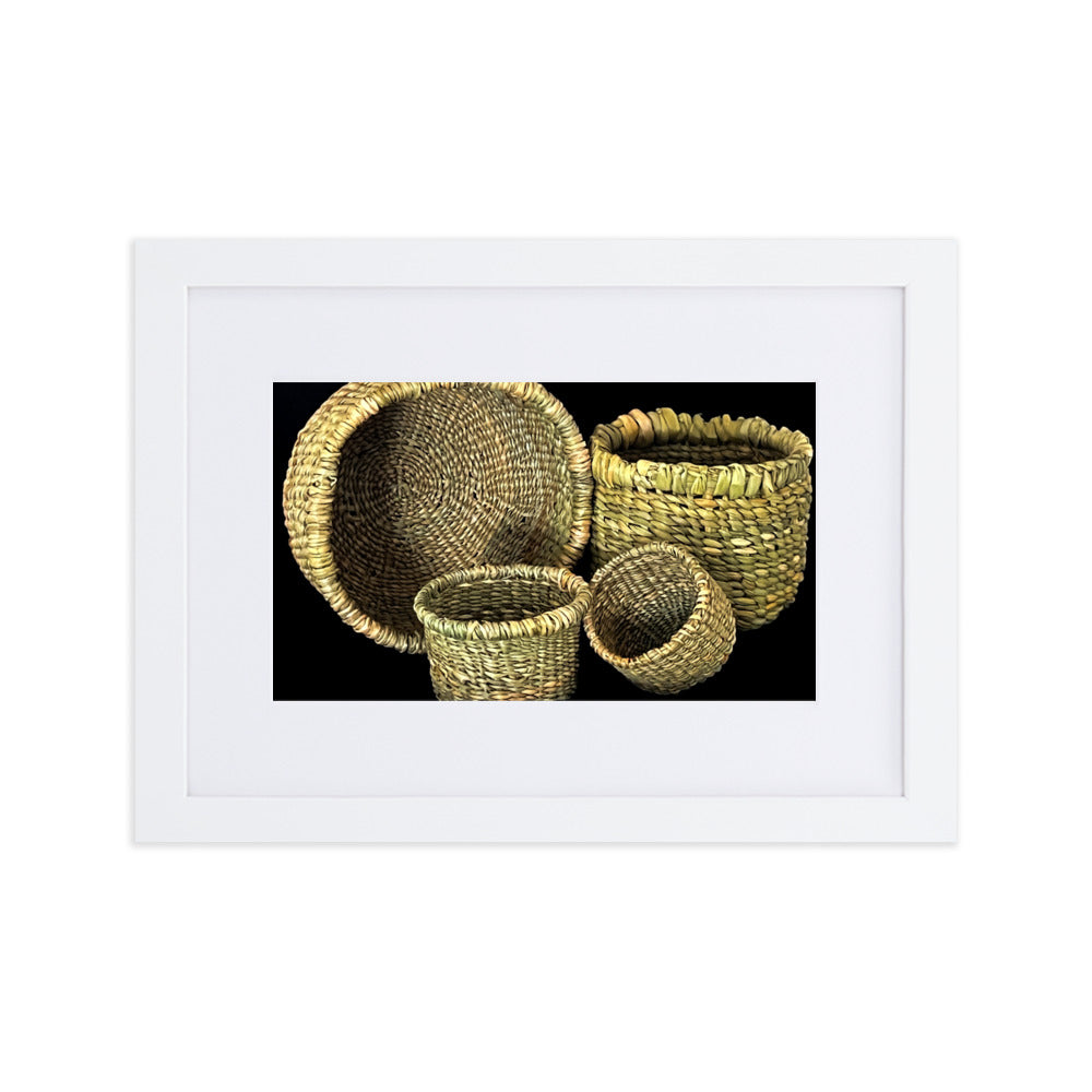 Four hand woven baskets on black background.