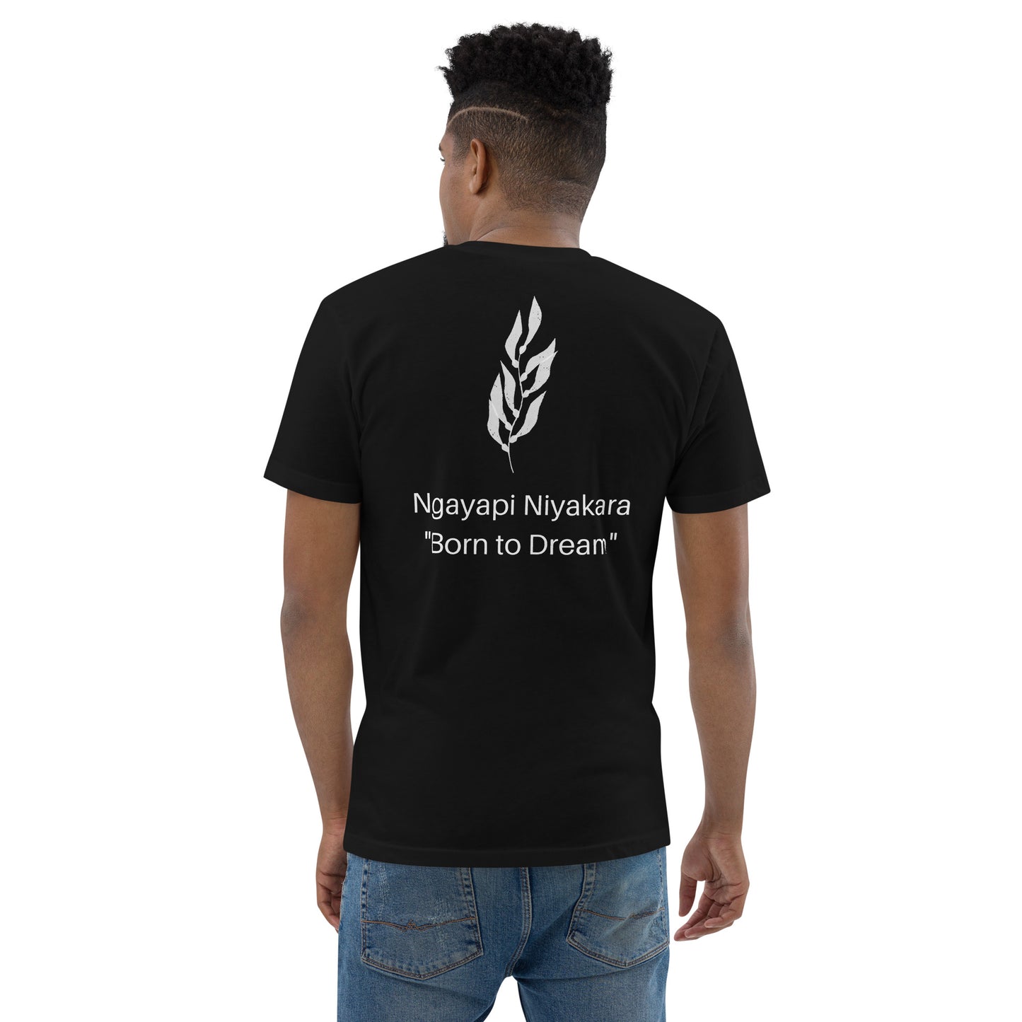 Black T-Shirt with kelp leaves with the words Ngayapi Niyakara "Born to Dream" printed underneath. Pictured with denim jeans.