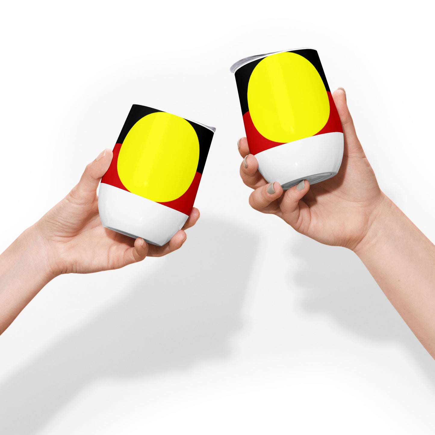 Stainless Steel; wine tumbler in white. Featuring Large Aboriginal flag. Front View. Two tumblers being posed together in cheers motion.